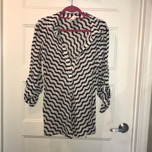Black and white colored button up, collared blouse